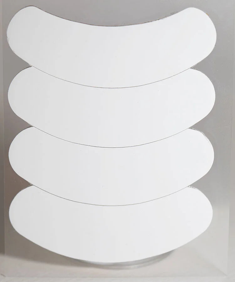 White oval-shaped 3d silicone gel eye patches stacked for lash technicians using gel eye patch treatment
