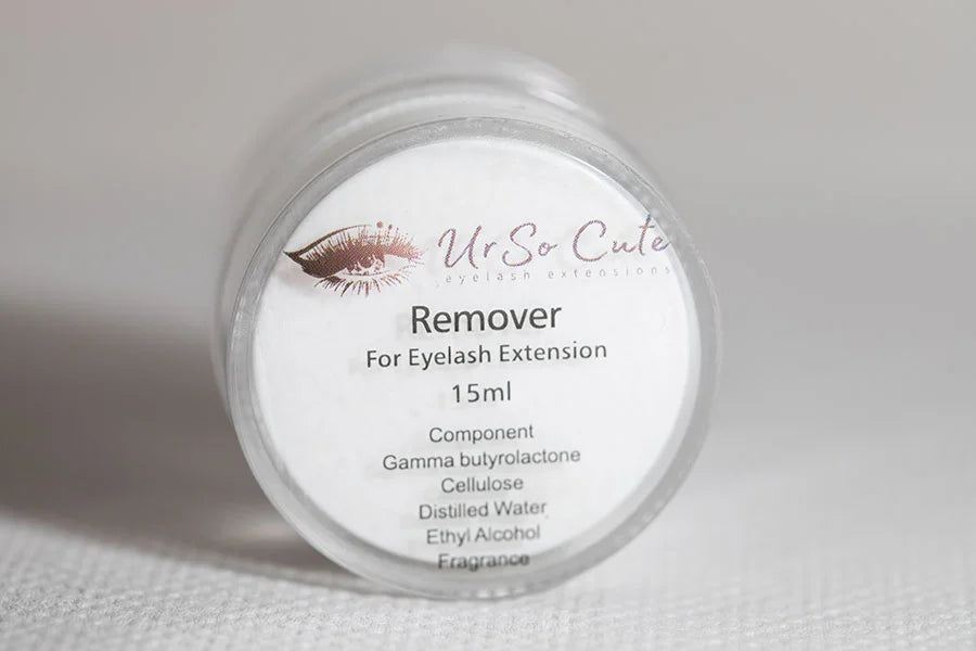 A clear cylindrical bottle with a white label from ur so cute containing 15ml creamy eyelash extensions remover