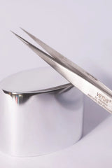 Silver precision tweezers with polished metallic finish and engraved branding perfect for hypoallergenic adhesive glue use