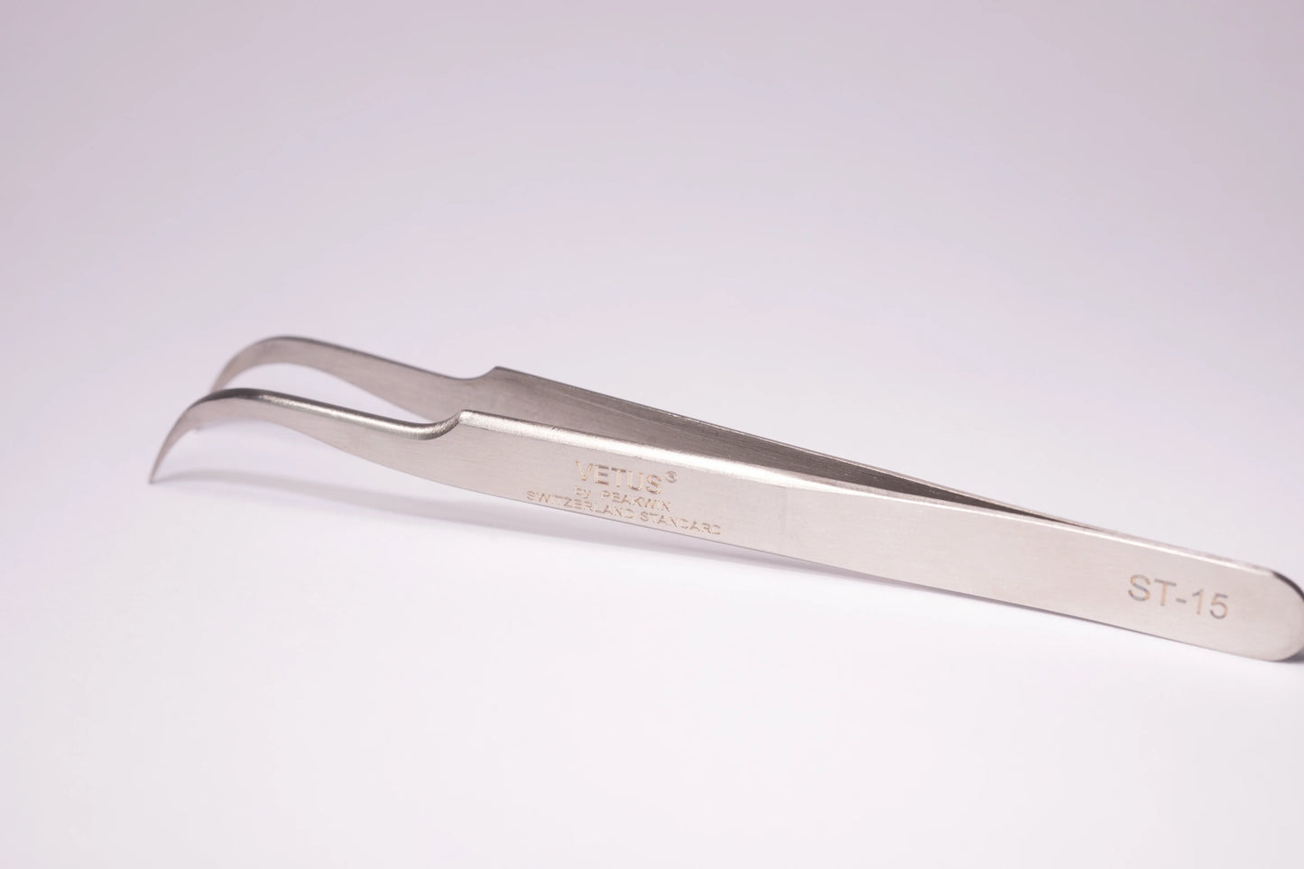 Silver stainless steel precision tweezers with curved pointed tips engraved st-15 ideal for hypoallergenic adhesive glue use